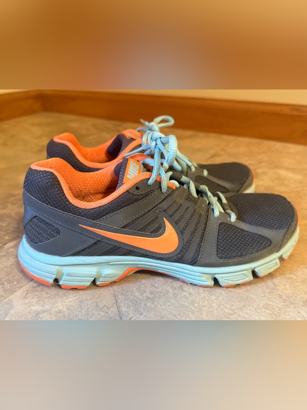 Nike Gray and Orange Running Shoes with Blue Accents